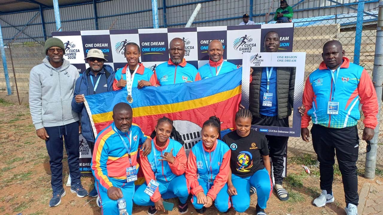 Bongiwe Mahlalela (3rd from L), who scooped a gold and bronze for Team Eswatini during the CUCSA Games, with some of the athletes and officials. (Pic: Sanele Jele)